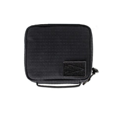 Black rectangular tactical pouch with textured fabric and arrow logo patch, zipper and handle, GORUCK gear