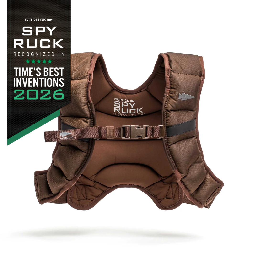 A brown GORUCK Spy Ruck weighted vest for women with a buckle closure, displayed next to a black badge noting it as one of TIME’s Best Inventions of 2026.