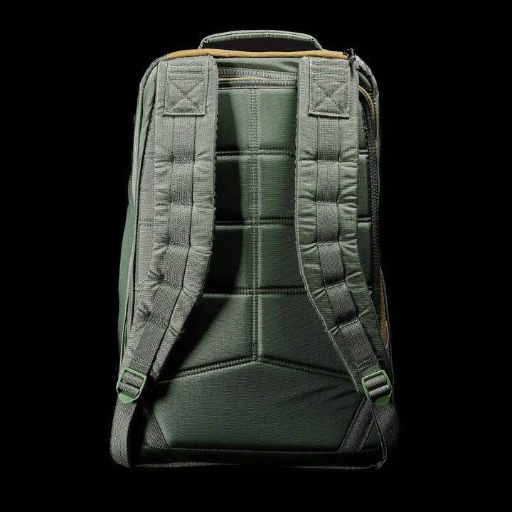 The GR1 USA - Ripstop ROBIC® by GORUCK, an ultra lightweight backpack in dark green with padded straps and a quilted texture on the back, is showcased against a black background.