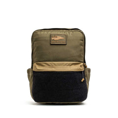 The KR1 2.0 - Kid Ruck is an olive green and black backpack with a front zip pocket and a rectangular "GORUCK" patch on top, designed as an indestructible school bag for adventurous kids.