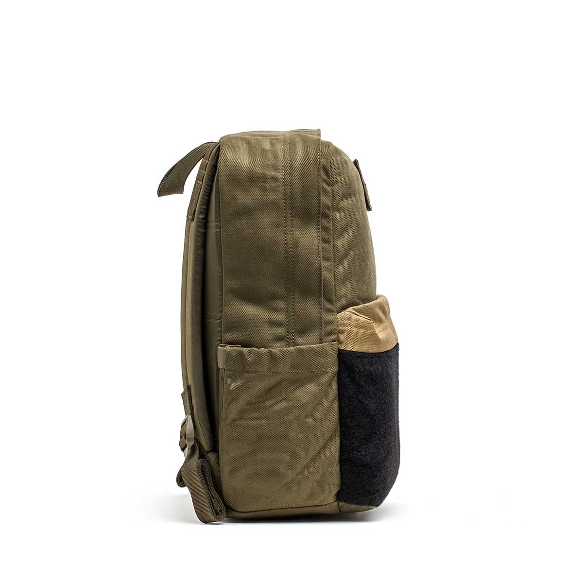 Side view of the KR1 2.0 - Kid Ruck, an olive green kids backpack with tan and black front pocket accents, shown on a white background.