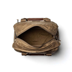 Top view of an open Kit Bag - Waxed Canvas in tan with brown handles on a white background, reminiscent of a classic pilot flight bag.