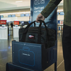 GORUCK Dyneema black kitbag as personal item in airport size check bin