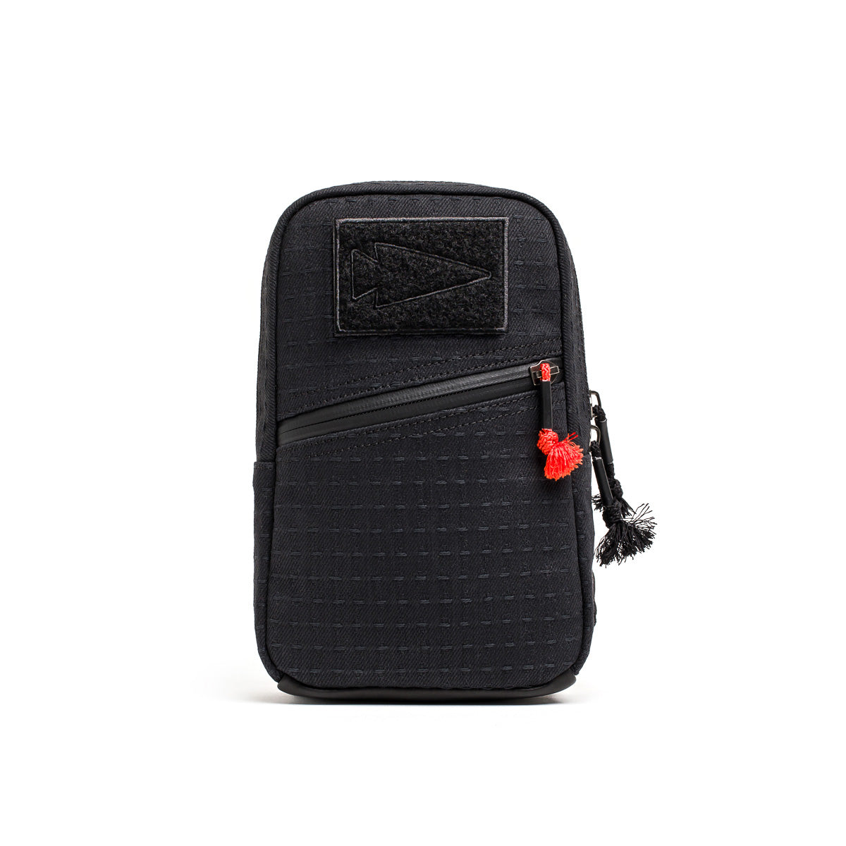 The GRenade x Carryology - GRXC2 Samurai 2.0 is a black zippered pouch with a front pocket, red zipper pull, and black top patch, designed for tactical sling use and enhanced waterproof performance.