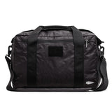 GORUCK black Dyneema duffle bag with shoulder strap and front zipper pocket