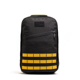 GORUCK black rucksack with gold MOLLE webbing, durable tactical backpack for rucking gear