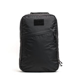 GORUCK black rucking backpack with angled front zipper pocket on white background