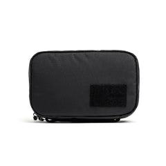 Black rectangular GORUCK Field Pocket with durable fabric and a hook-and-loop patch on front