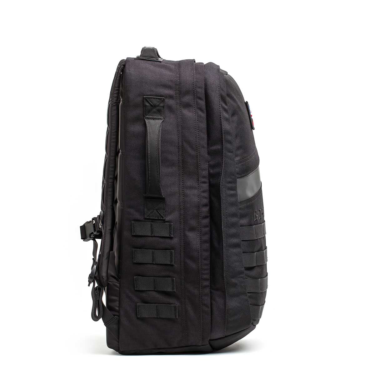 The Rucker - Long Range, a black tactical backpack designed for comfortable distance rucking, is shown upright from the side against a white background.