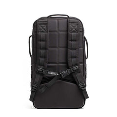 The Rucker - Long Range is a black backpack shown from the back, featuring padded shoulder straps and a sternum strap—built for distance rucking or events, and stands upright for easy access.