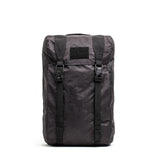 GORUCK black Dyneema rucksack, rugged outdoor backpack with buckle straps on white background