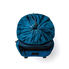 GORUCK dark blue rucksack top view with drawstring closure and open front pocket