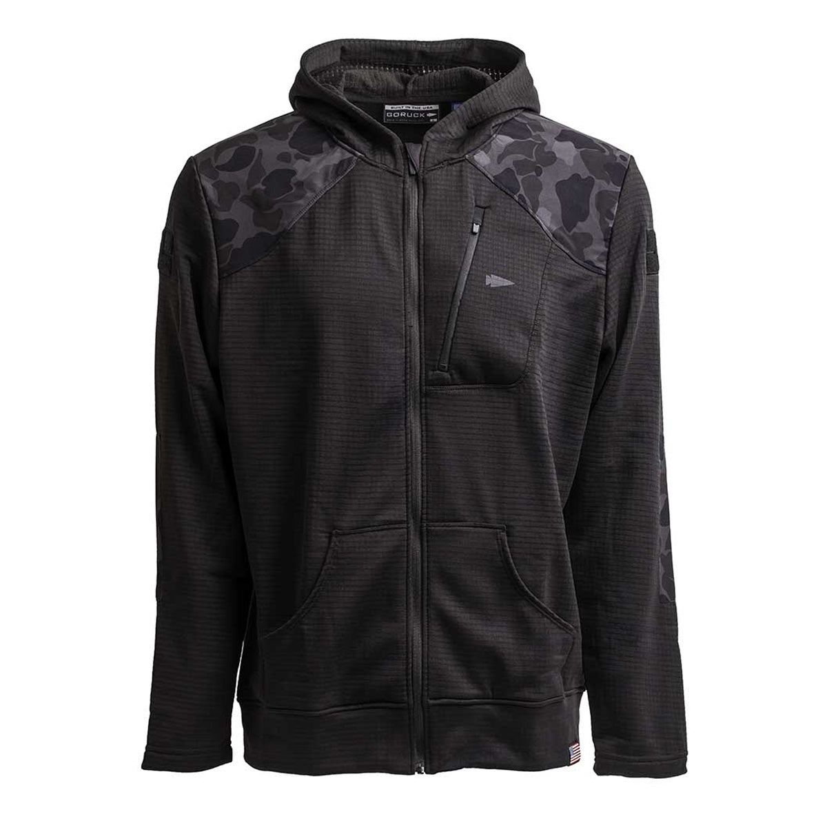 Introducing the Men’s Full Zip - Polartec Grid Fleece by GORUCK, a black hooded jacket showcasing a camo pattern on the shoulders and sleeves. It features a front zipper and pocket details, crafted with Polartec Power Grid fabric for superior breathability and warmth.