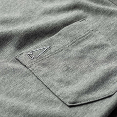 Close-up of a gray Men's Long Sleeve Pocket Tee - Tri-Blend, featuring a small embroidered arrowhead above the pocket.