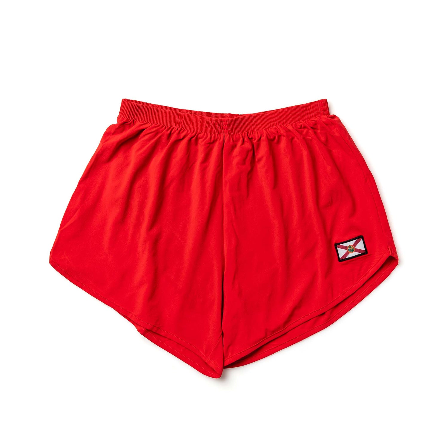 The Men’s Ranger Panties - ToughStretch are bright red PT shorts with an elastic waistband and a small patch on the lower right leg, made from durable ToughStretch fabric.