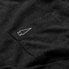 Close-up of the Men's Short Sleeve Pocket Tee - Tri-Blend in premium black, crafted from ultra-soft Tri-BlendX fabric with a small white-outlined paper airplane stitched above the pocket.