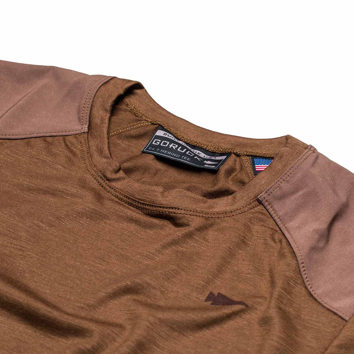 Close-up of the Men’s Commando Tee - Merino Wool in brown, featuring reinforced shoulders, a visible 