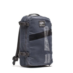A gray Mesh Ruck backpack by GORUCK, quick-drying with side straps and a top handle, is shown upright on a white background.
