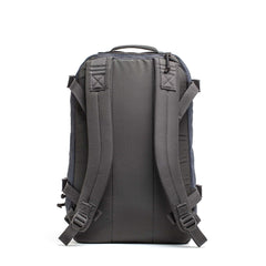The Mesh Ruck is a gray quick-drying backpack, displayed from the back, with padded shoulder straps, a top handle, and durable materials—perfect for everyday use.
