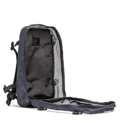 The Mesh Ruck is a gray mesh backpack with its main compartment fully unzipped for easy access, making it an ideal quick-drying backpack or convenient beach bag.