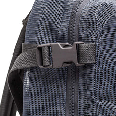 Close-up of the Mesh Ruck, a black mesh backpack featuring a plastic buckle and zipper—ideal as a quick-drying beach bag.