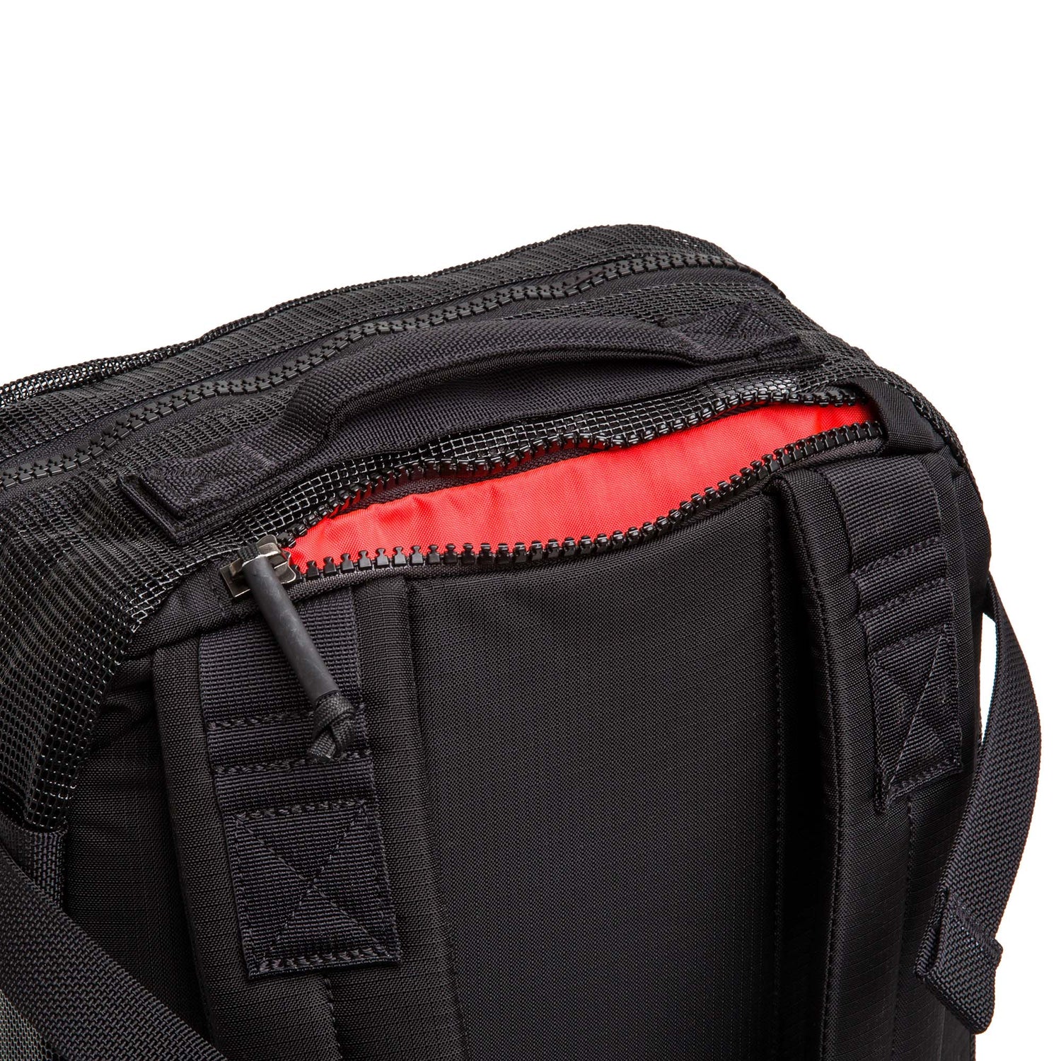 Close-up of the Mesh Ruck backpack, featuring a quick-drying design and red lining visible inside the partially open zipper compartment.