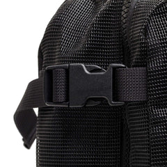 Close-up of black mesh fabric backpack strap with plastic buckle and textured rucking gear detail by GORUCK