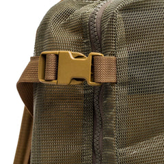 Close-up of the Mesh Ruck, a khaki mesh backpack featuring brown buckle and zipper details—ideal for use as a beach bag.