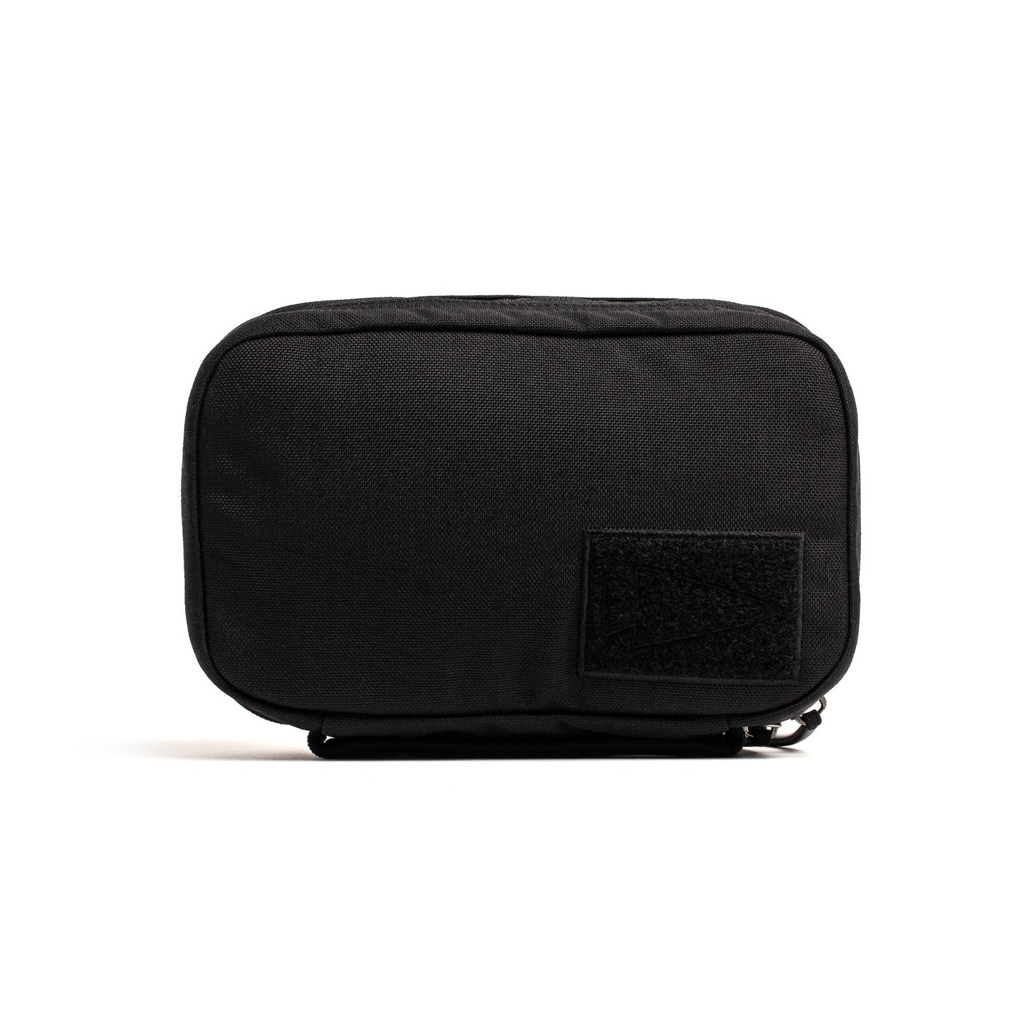 The GR1 Field Pocket - USA is a small, rectangular black pouch with a front patch, ideal for organizing electronics, shown against a white background.
