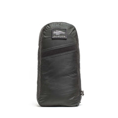 A dark gray Packable Bullet Ruck - Ripstop ROBIC® backpack stands upright, featuring a small front patch, AquaGuard zippers, and a side zipper.