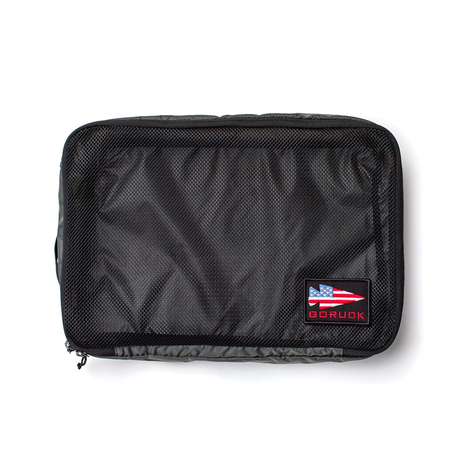 Packing Cubes are black zippered organizers made from durable 200D nylon with a mesh front for easy visibility, plus a GORUCK patch featuring an American flag and red spearhead—ideal for keeping your travel items organized.