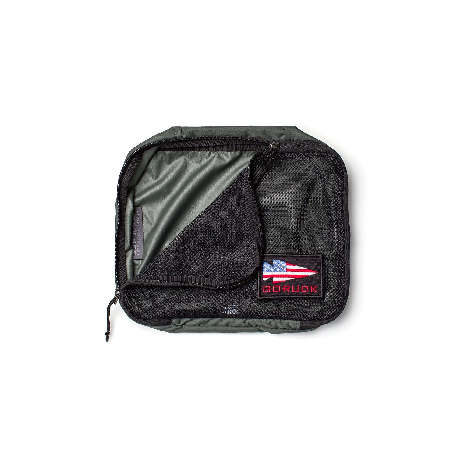 The Packing Cubes feature durable 200D nylon, a mesh zippered cover, and a GORUCK patch with an American flag in green—ideal for streamlining your travel organization.
