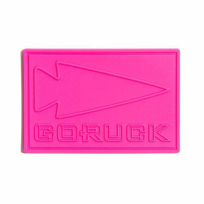 The PVC Patch - GORUCK is bright pink and features a spearhead design on a white background, inspired by the Special Forces.