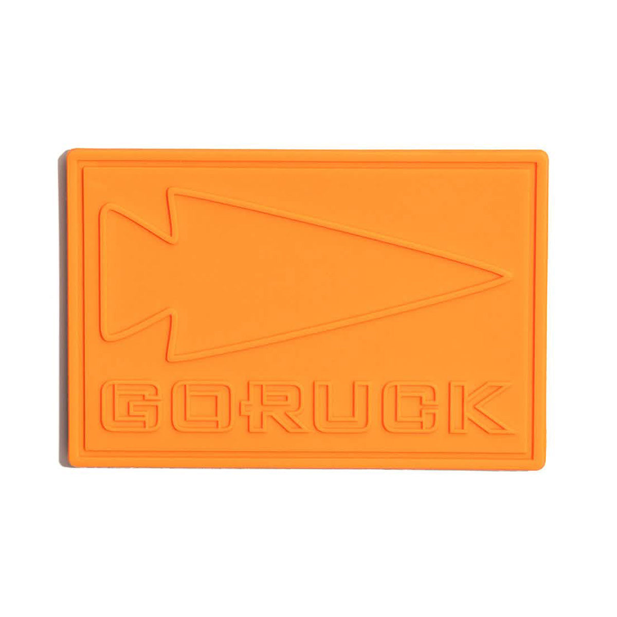 Orange PVC Patch - GORUCK is made from durable plastic with an arrowhead design and "GORUCK" embossed, inspired by Special Forces resilience.