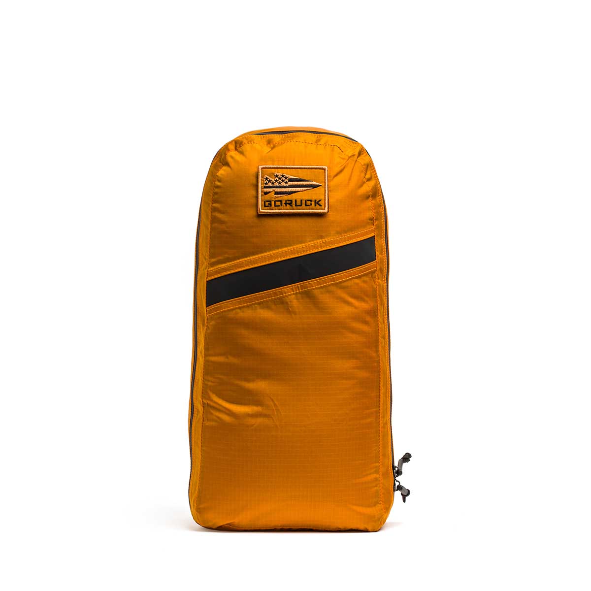 An orange GORUCK pouch with a black stripe and front patch pairs perfectly with your Packable Bullet Ruck - Ripstop ROBIC®, and stands upright.
