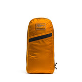 An orange GORUCK pouch with a black stripe and front patch pairs perfectly with your Packable Bullet Ruck - Ripstop ROBIC®, and stands upright.