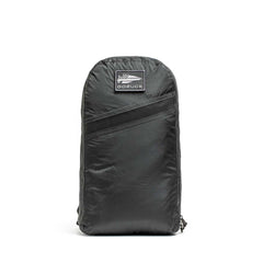 The Packable Bullet Ruck - Ripstop ROBIC® is a black GORUCK backpack made from robust ripstop nylon, featuring a front zip pocket and logo patch—ideal as a lightweight day bag.