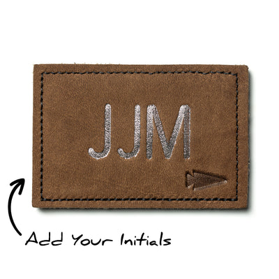 Custom leather monogram patch with silver initials "JJM" and arrow icon, personalized with "Add Your Initials" for customization.