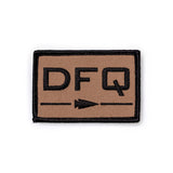 GORUCK DFQ patch in tan with black lettering and arrow, durable rucking gear accessory