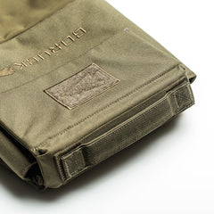 A close-up of the olive-green RPC 3.0 + 10lb Ruck Sandplate, featuring sturdy stitching, a Velcro patch, and dedicated space for the sandplate—ideal for weighted training or as a versatile Ruck Plate Carrier.