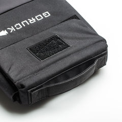Close-up of a black RPC 3.0 + 10lb Ruck Sandplate backpack, highlighting the handle and front velcro patch area—ideal for weighted training with the included sandplate.