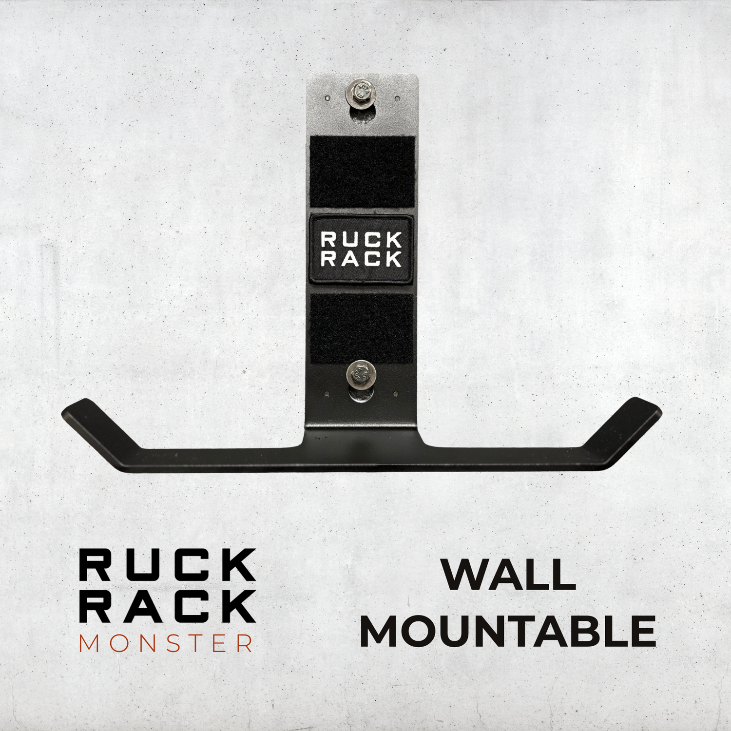 Ruck Rack® Monster—versatile wall-mount for rucks, weight vests, and tactical gear—displayed in black with bold “RUCK RACK” branding against a gray backdrop. Text reads “WALL MOUNTABLE.” The ultimate organizer for your American-made gear storage needs.