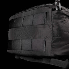 Close-up of black GORUCK tactical backpack fabric with MOLLE webbing and durable stitching