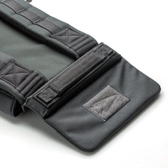Close-up of a black RPC 3.0 + 10lb Ruck Sandplate carrier strap, highlighting the stitching and a patch with a simple arrow design.