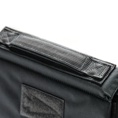 Close-up of the RPC 3.0 + 10lb Ruck Sandplate, featuring durable black fabric, a reinforced handle, side velcro patch, and space for the included sandplate—perfect for weighted training.