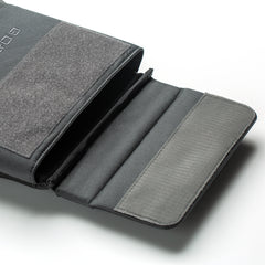 A gray fabric carrying case with flap open shows padded compartments, ideal for storing the RPC 3.0 + 10lb Ruck Sandplate, displayed on a white background.