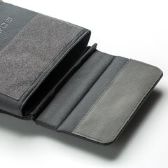A close-up of an open gray pouch with multiple compartments, ideal for organizing gear such as the RPC 3.0 + 10lb Ruck Sandplate, set against a white background.