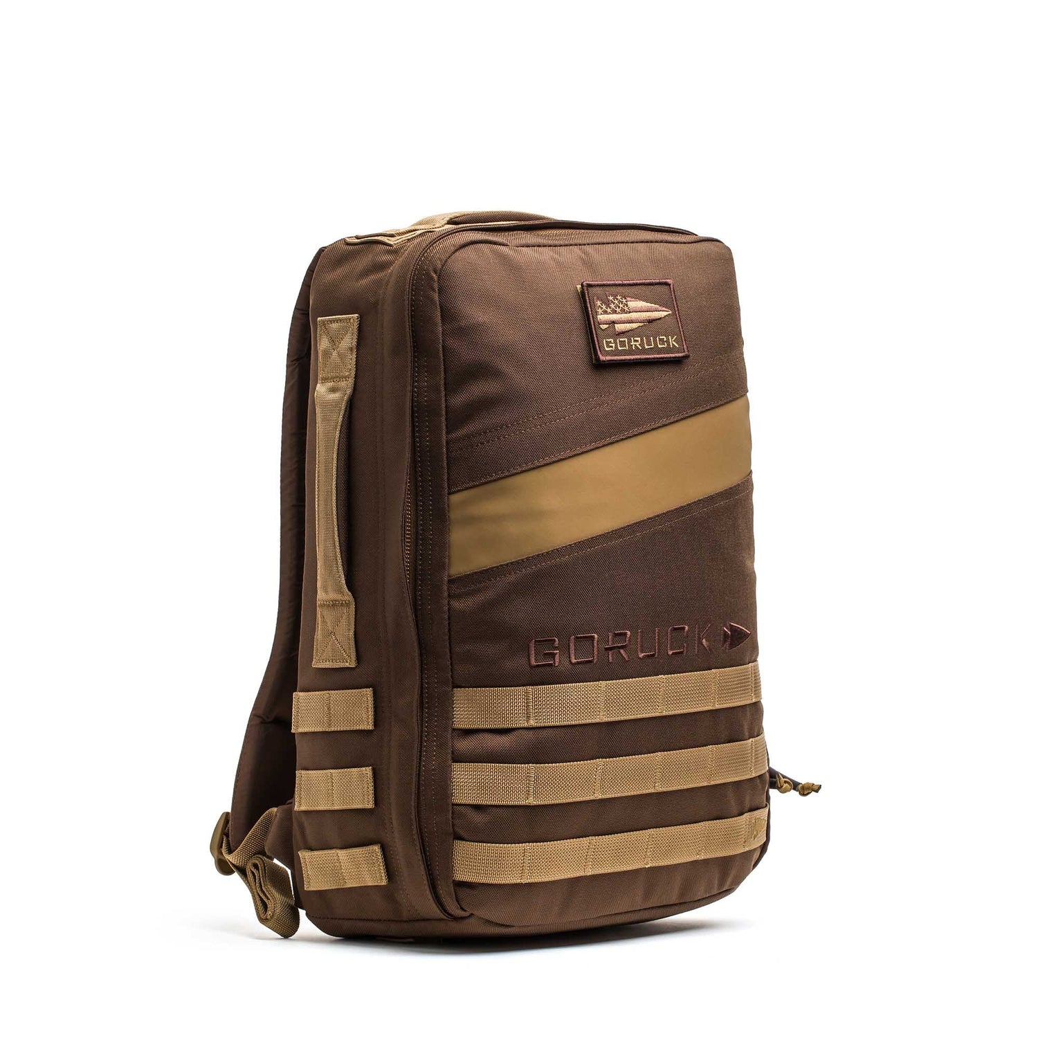 The Rucker 4.0 is a brown GORUCK rucking backpack with tan accents, front and side MOLLE webbing, an American flag patch, and a design compatible with ruck plates.