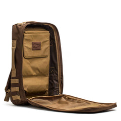 The Rucker 4.0 is a brown backpack with a zipper, ideal for daily use or as a weighted training pack.