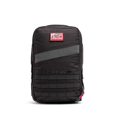 The 20L Rucker 4.0 - GORUCK x Arnold’s Pump Club features a black design, red and white patch, front zipper, and horizontal webbing—perfect for rucking or carrying your Arnold’s Pump Club essentials.